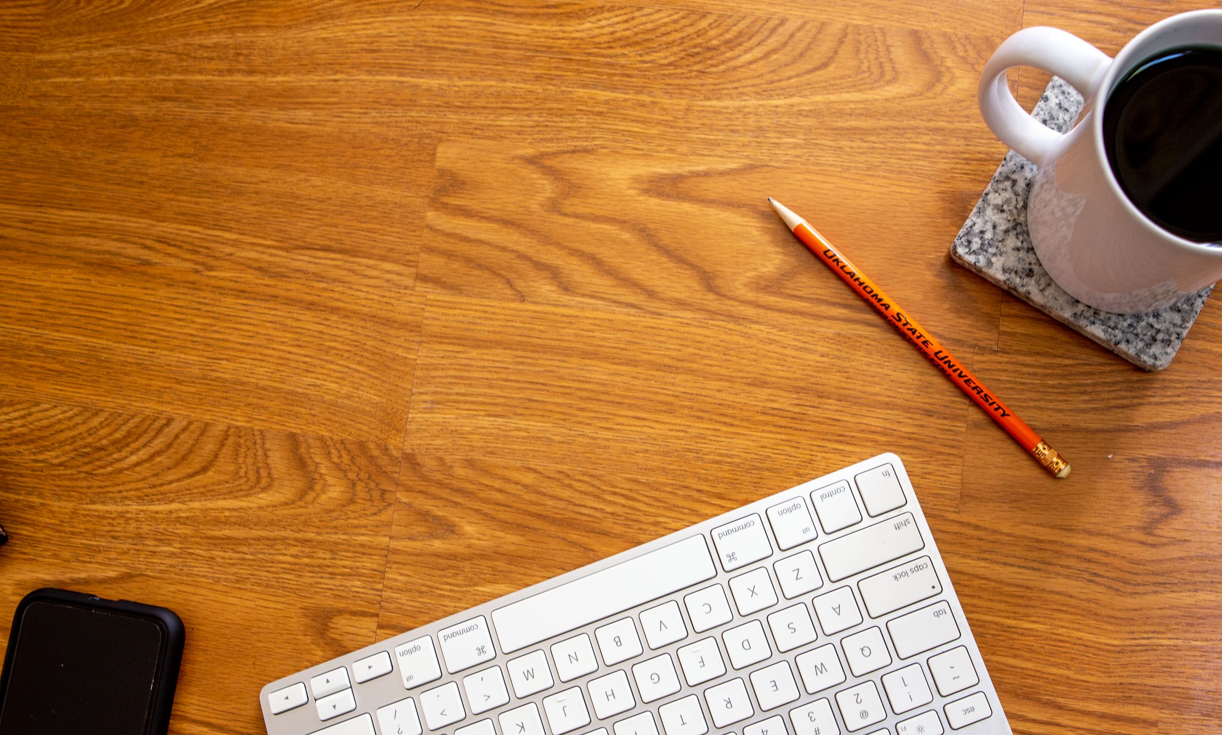 desk with keyboard and pencil